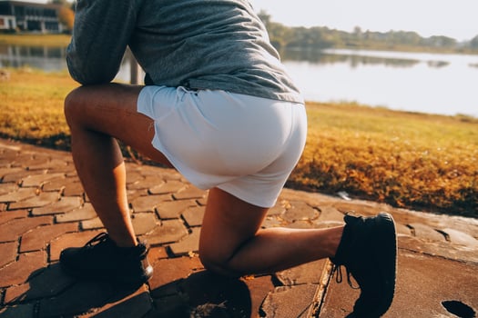 Athlete runner feet running on road photo