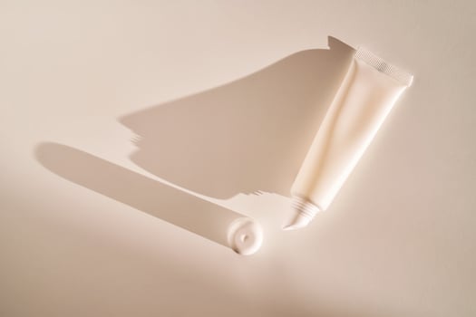 Hygienic moisturizing lip balm in a tube on a white background. photo