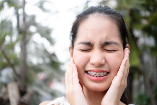 Portrait of a young asian woman with braces on her teeth photo