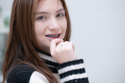 Portrait of Teenage girls with braces on her teeth photo