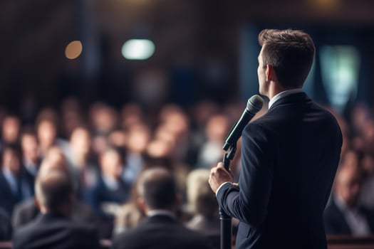 AI generated Speaker Giving a Talk at Business Conference. Audience at the conference hall. Business and Entrepreneurship. photo