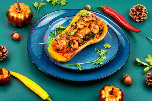 Baked pumpkin stuffed with vegetables and shrimp. photo