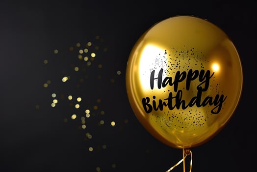 AI generated Generative AI, golden balloon with congratulation, Happy Birthday, black background photo
