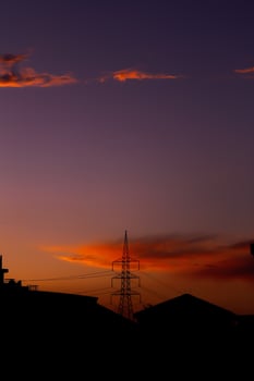 Silhouette of a tower against the purple sky photo