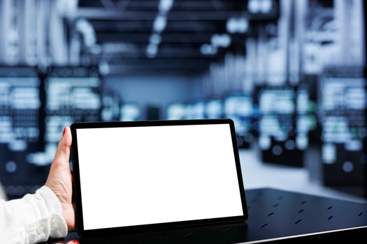 Close up shot of mock up tablet used by technician in server hub delivering immense computing power, capable of processing and storing large amounts of data and controlling network resources photo