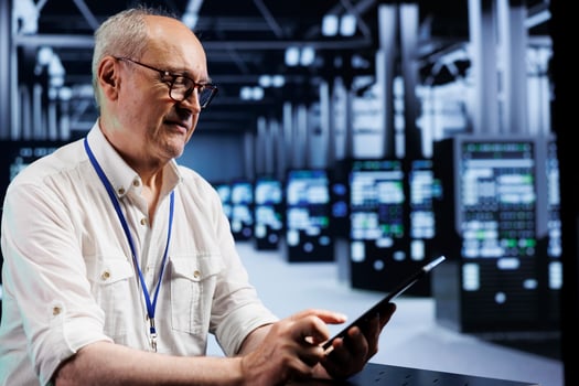 Knowledgeable electrician in data center providing dedicated VPN servers able to deliver encrypted sensitive data, reinforced privacy, online anonymity and secure internet connections to users photo