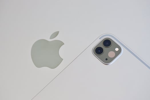 KYIV, UKRAINE - 4 MAY, 2023 Apple brand device ipad lies on macbook body photo