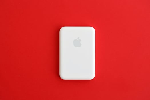 KYIV, UKRAINE - OCTOBER 31, 2023 Apple MagSafe battery device for iPhone charging via magnet connection. Mag Safe modern portable power bank photo