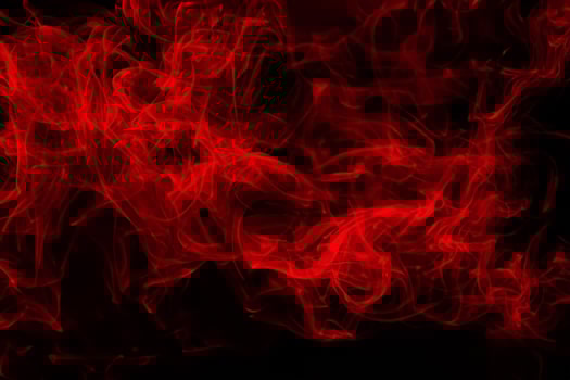 Fluffy Puffs of Smoke and Fog on Black Background, fire design and darkness concept photo