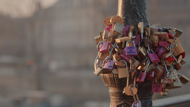 Numerous padlocks lock on the fence on the bridge. photo