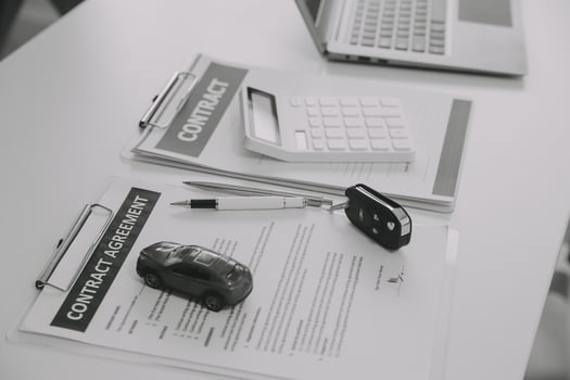 Closeup asian male people car salesman or sales manager offers to sell a car and explains and reads the terms of signing a car contract and insurance. photo