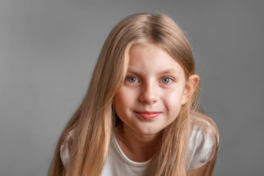 Portrait of cute little girl with long light hair photo