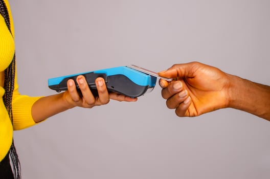 customer making payment with card using point of sales photo