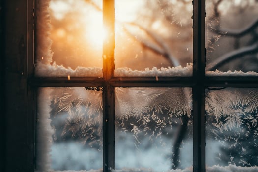 AI generated Snow on the window at sunset. Beautiful winter landscape with snow covered trees. photo
