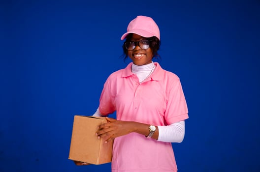 beautiful african delivery woman holding a package photo