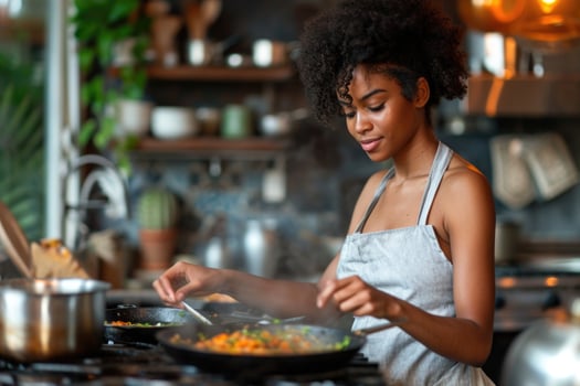 AI generated A young African American girl is cooking in the kitchen at home photo