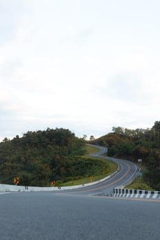 Beautiful curved road known as number 3 road on the high mountain along the way to Bo Kluea district in Nan province, Thailand. photo