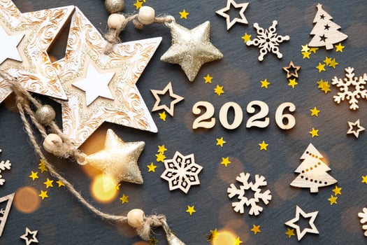 Happy New Year-wooden letters and the numbers 2026 on festive black background with sequins, stars, snow. Greetings, postcard. Calendar, cover photo