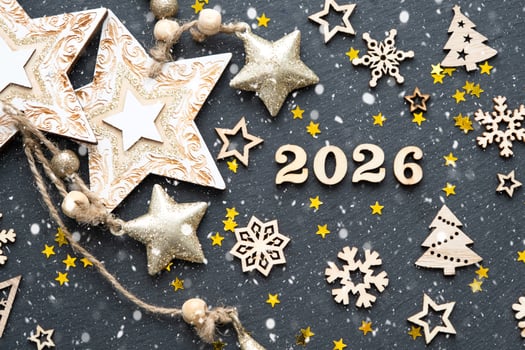 Happy New Year-wooden letters and the numbers 2026 on festive black background with sequins, stars, snow. Greetings, postcard. Calendar, cover photo