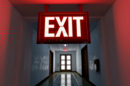 AI generated The Exit sign glowing in red shows the word EXIT to doorway. Generative AI. photo