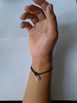 Photo of bracelet with zodiac pendant. This photo is suitable for advertising photos, calendars, magazines, posters, banners