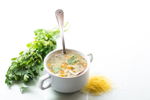 cooked hot soup with noodles and vegetables photo