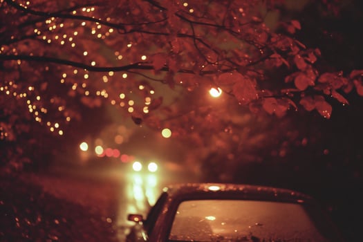 AI generated Car on the road at night in the rain, defocused lights photo