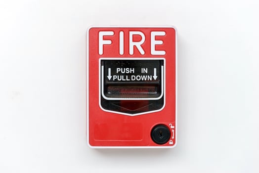 Fire alarm switch box on white wall for warning photo