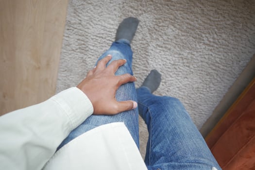 Close up on man suffering knee joint pain photo