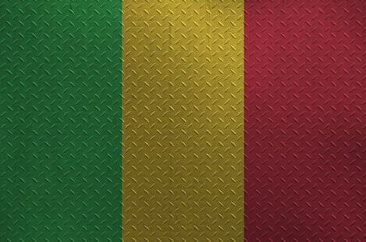 Mali flag depicted in paint colors on old brushed metal plate or wall closeup. Textured banner on rough background photo