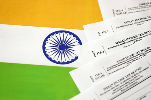 Indian income tax return blank forms on indian country flag photo