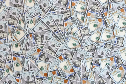 Very big amount of US hundred dollar bills. Huge quantity of united states currency notes on flat table photo