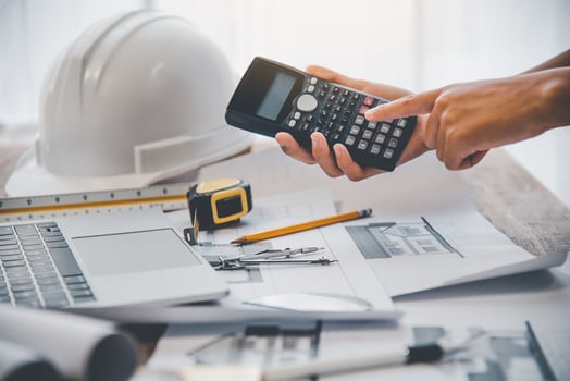 engineer use calculator working in office with blueprints, inspection in workplace for architectural plan, construction project, Business construction photo