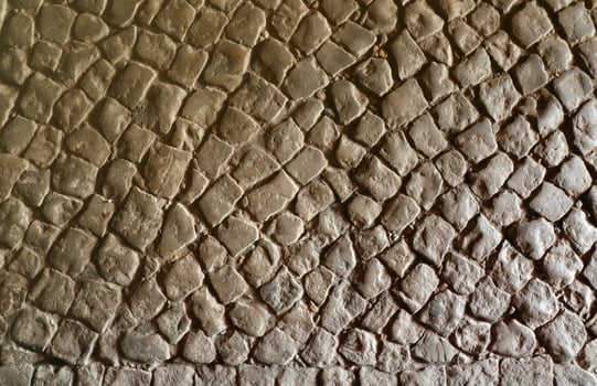 Paving stone pavement background texture. Cobblestone pave top view of old stony sidewalk photo