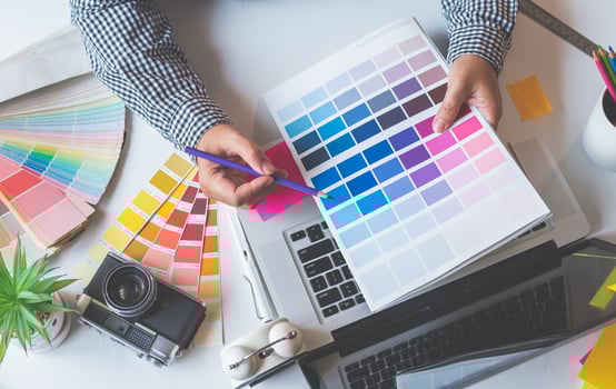 The graphic designer creative team is currently working on the design and color selection on the guide color for advertising design. photo