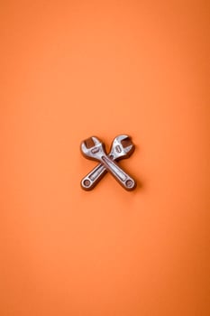 Tools and inscriptions symbolizing repairs or a garage and its attributes on a plain background photo
