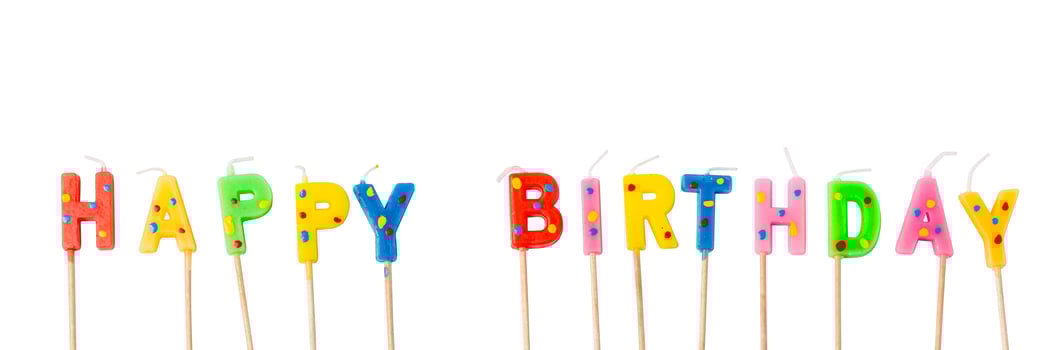 Colorful candles in letters saying Happy Birthday, photo