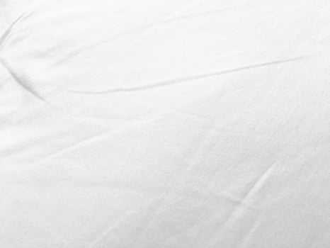 An exquisite cloth material in a bright, white hue, its smooth and silky surface evoking a sense of luxury and quality for a sophisticated background. photo