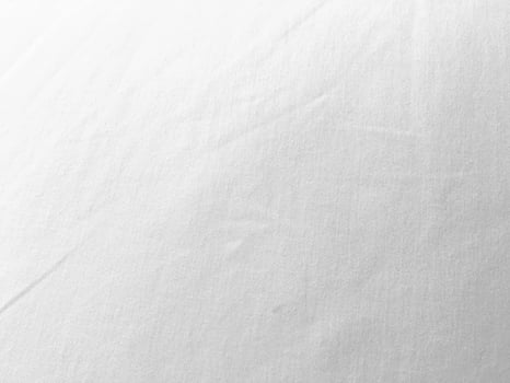 An exquisite cloth material in a bright, white hue, its smooth and silky surface evoking a sense of luxury and quality for a sophisticated background. photo