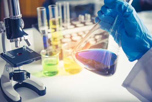 Equipment and science experiments oil pouring scientist with test tube yellow making research in laboratory. photo