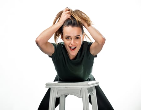 Woman Sitting on White Stool. photo