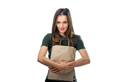 A Woman Holding a Brown Paper Bag photo