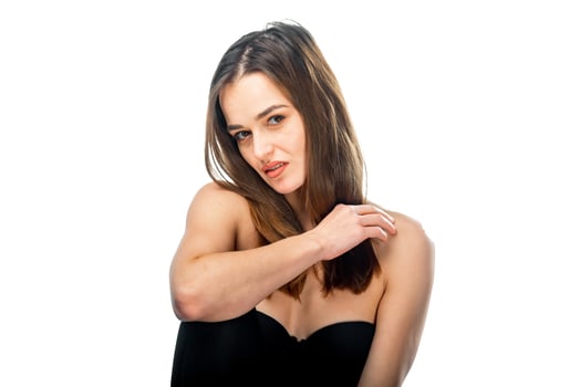 A Stylish Woman in a Black Strapless Dress. A woman in a black strapless dress posing for a picture photo