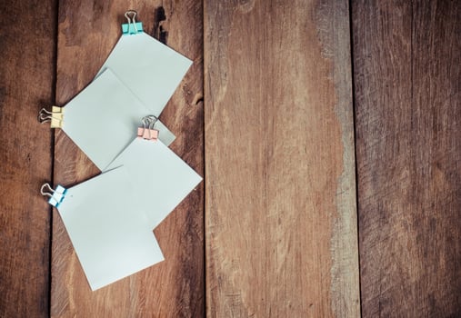 paper note on wooden background photo