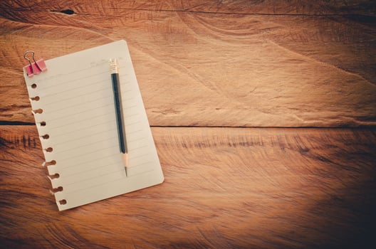 The white paper notes on the wooden floor photo