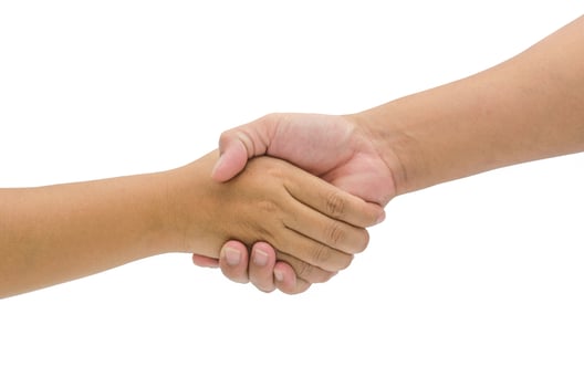 Shaking hands of two male people, isolated on white photo