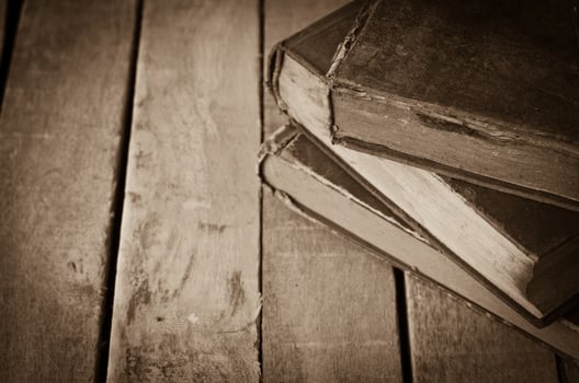 Old books on the wooden floor photo