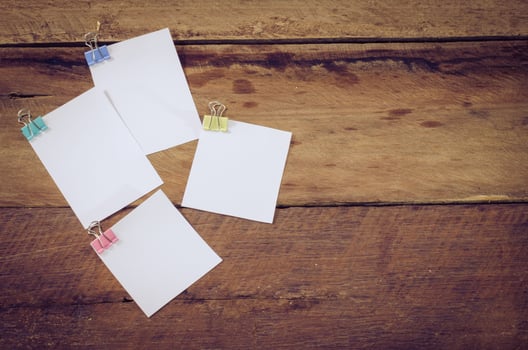 paper note on wooden background photo