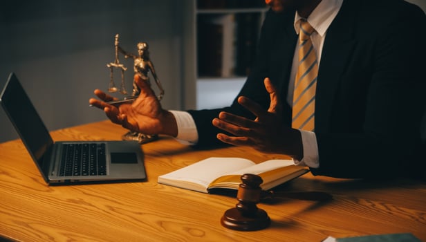 Judge gavel with Justice lawyers having team meeting at law firm background. Concepts of Law and Legal services. photo