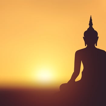 Silhouette the buddha statue on sunset background photo